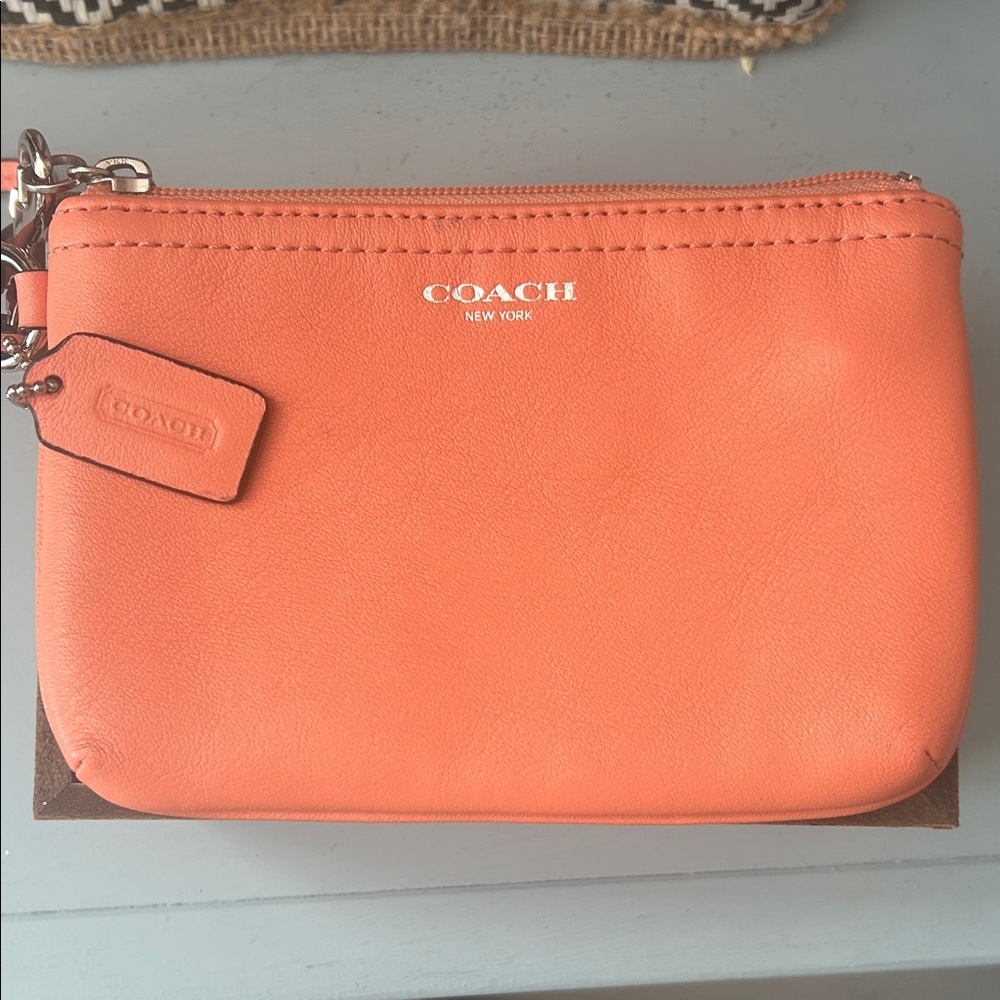 Coach peach color Leather Wristlet